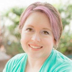 Alexa Bigwarfe with pink hair and a cyan cardigan