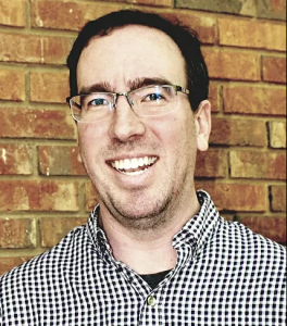 Bradley Metrock wearing a striped black and white shirt