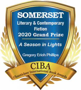 A blue and gold badge for the 2020 Grand Prize Winner for Somerset Literary and Contemporary Fiction A Season in Lights By Gregory Erich Phillips