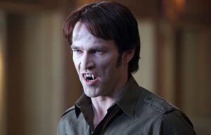 Bill Compton of True Blod showing his fangs