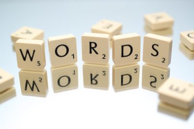 An image of Scrabble Tiles spelling out the word "Word"