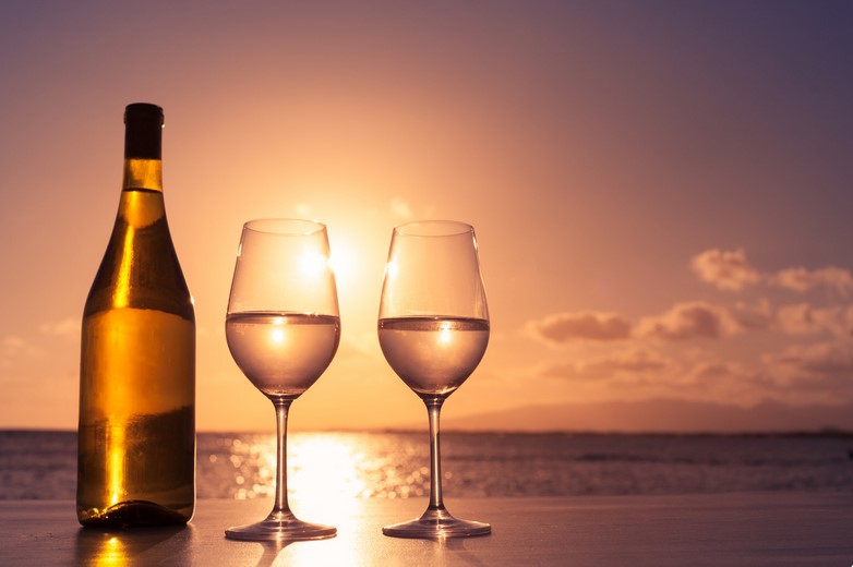 Wine on the beach, a perfect companion to a Chatelaine Romance Read
