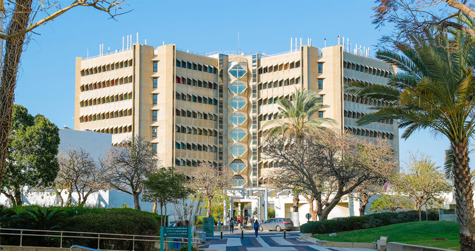 Tel Aviv University Medical School is a soft yellow with many windows and angles 