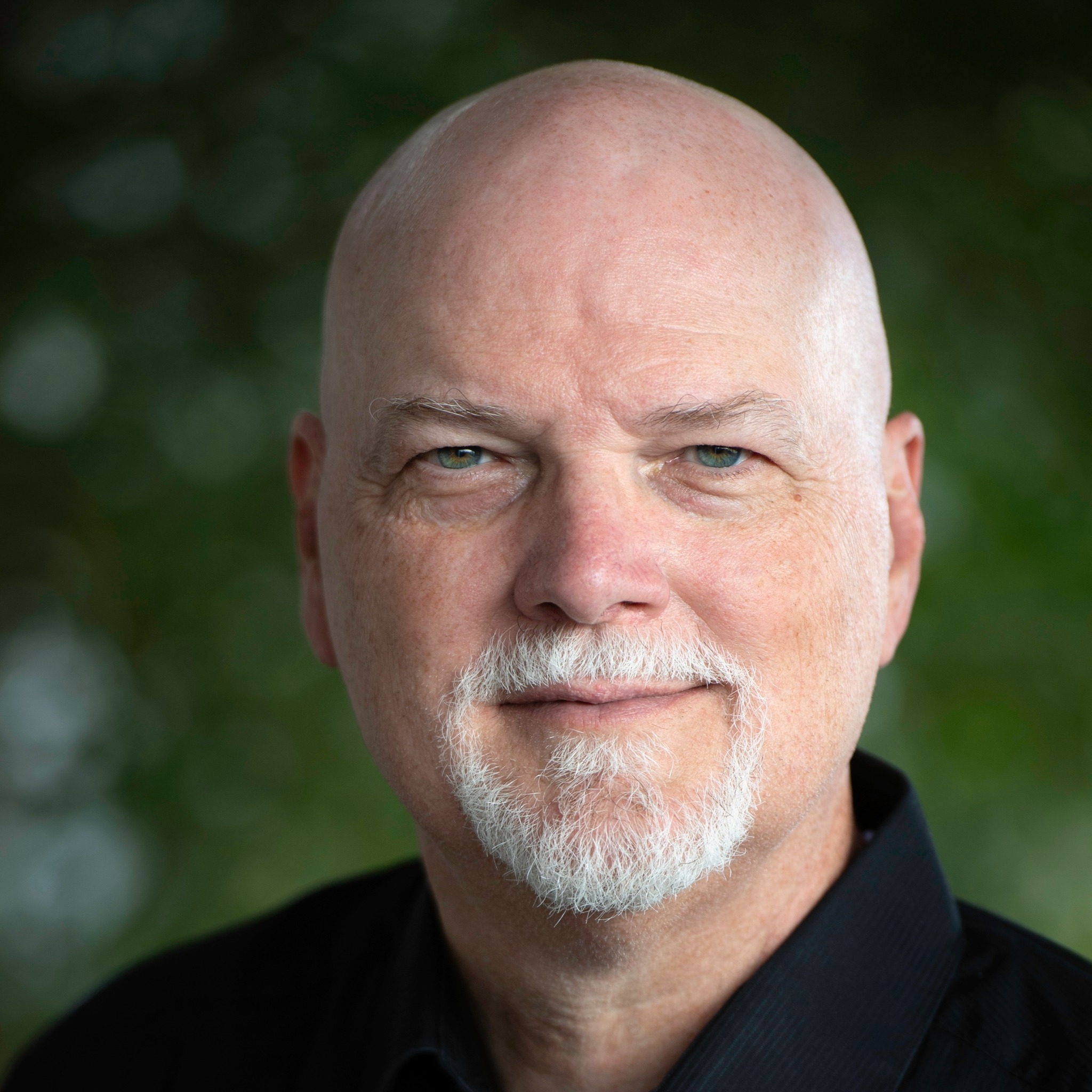 Tom Goodman, writer, author, the last man, westerns, black shirt, gotee, grey hair, bald