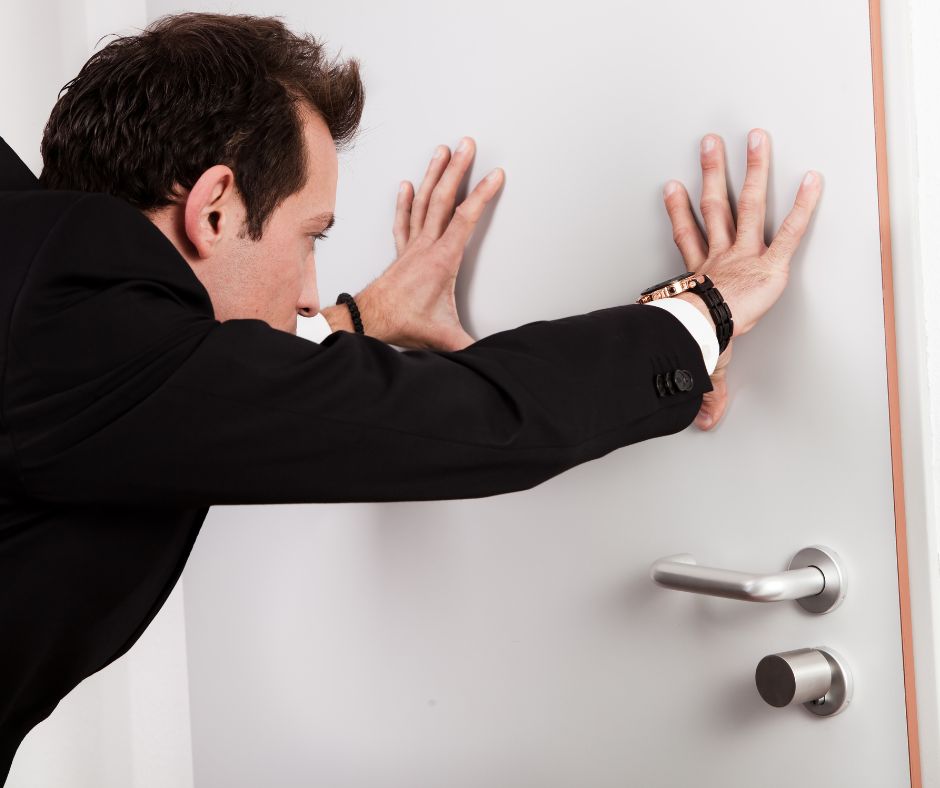 door, man, black suit, pushing, door handle, lock