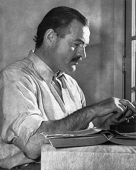 Hemingway, black and white, typewriter, writing, desk, white shirt, glasses