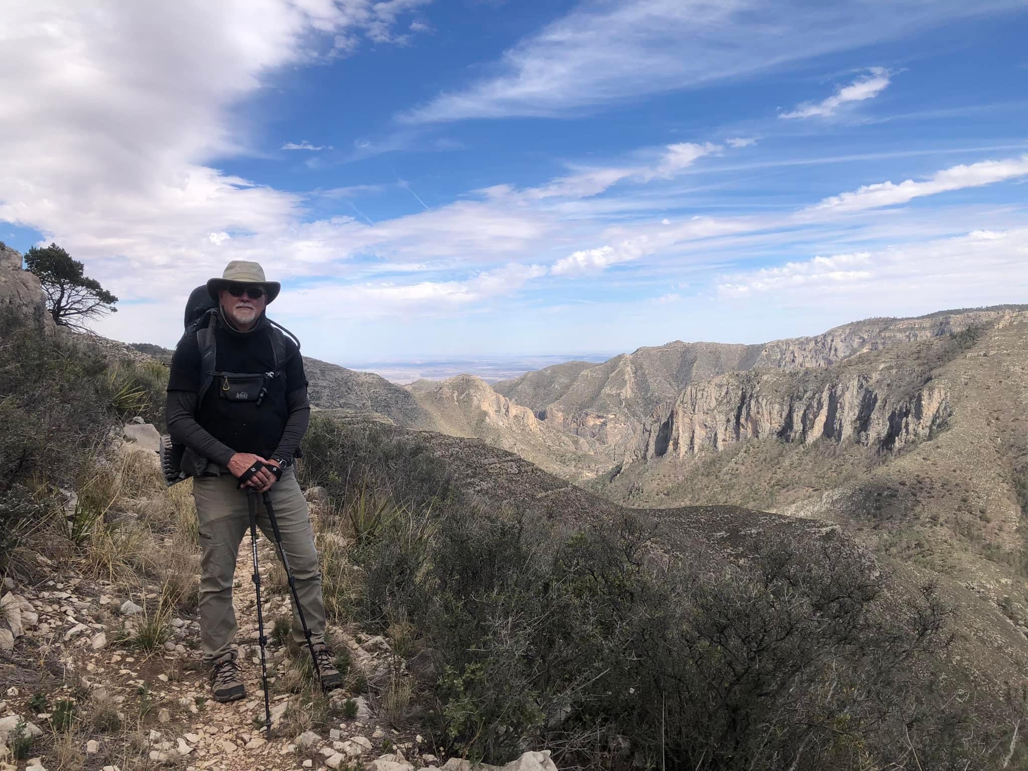 sky, rock, cliffs, man, hiking, tom goodman, backpack, clouds