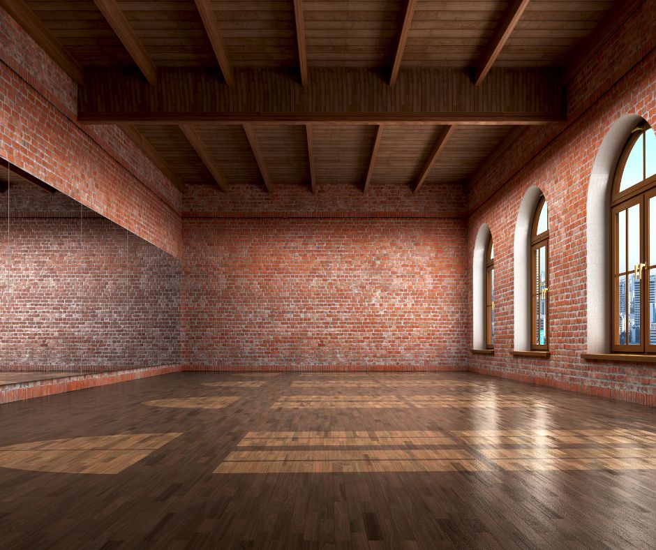 Brick walls, windows, wood beams, wood floor