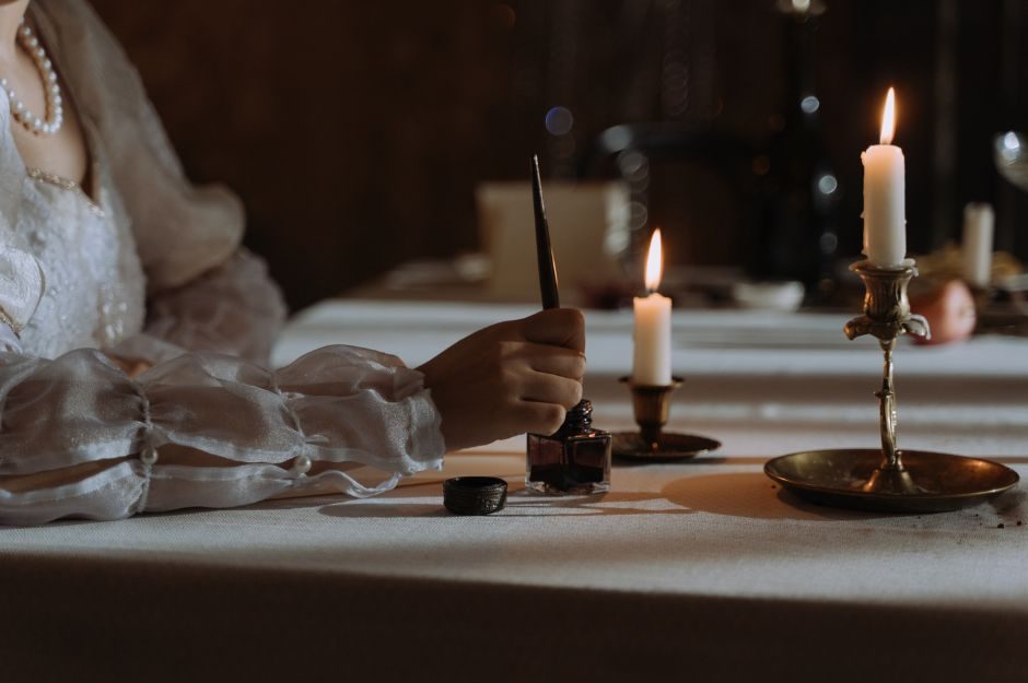 quill, candle, arm 