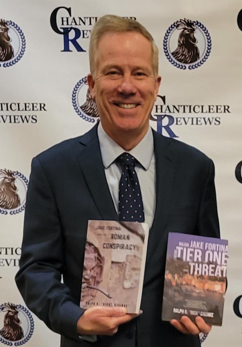Ralphe Steinke, Two books, Chanticleer backdrop, man, suit