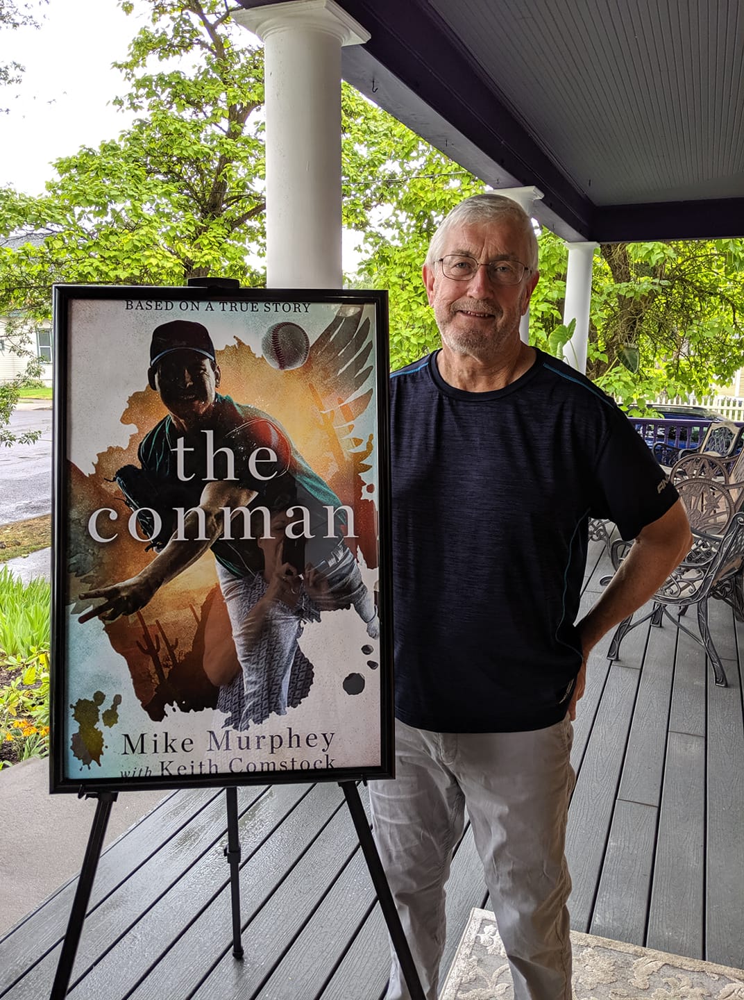 man, sign, porch, trees