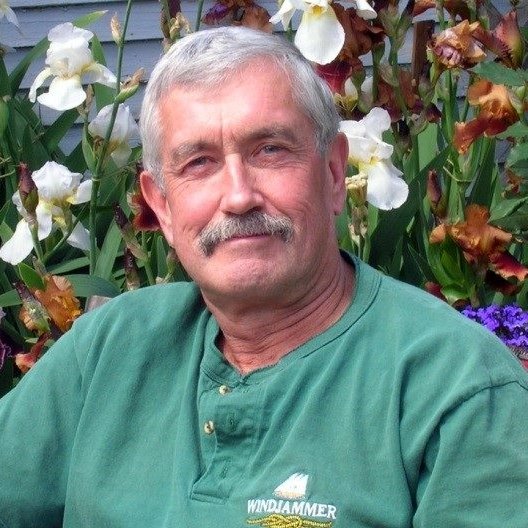 man, flowers, green shirt