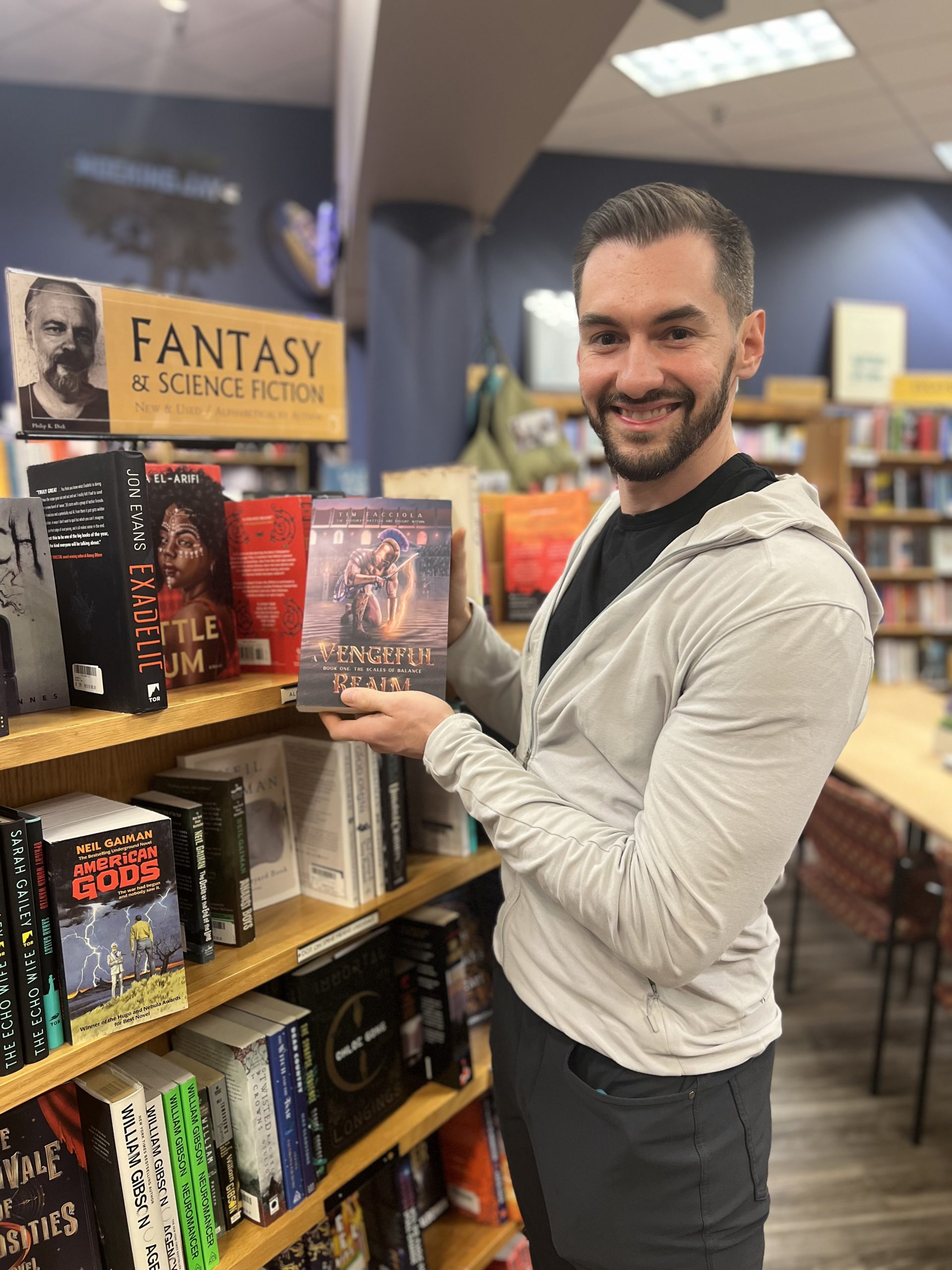 bookstore, books, bookshelves, tim facciola, beard, hoodie