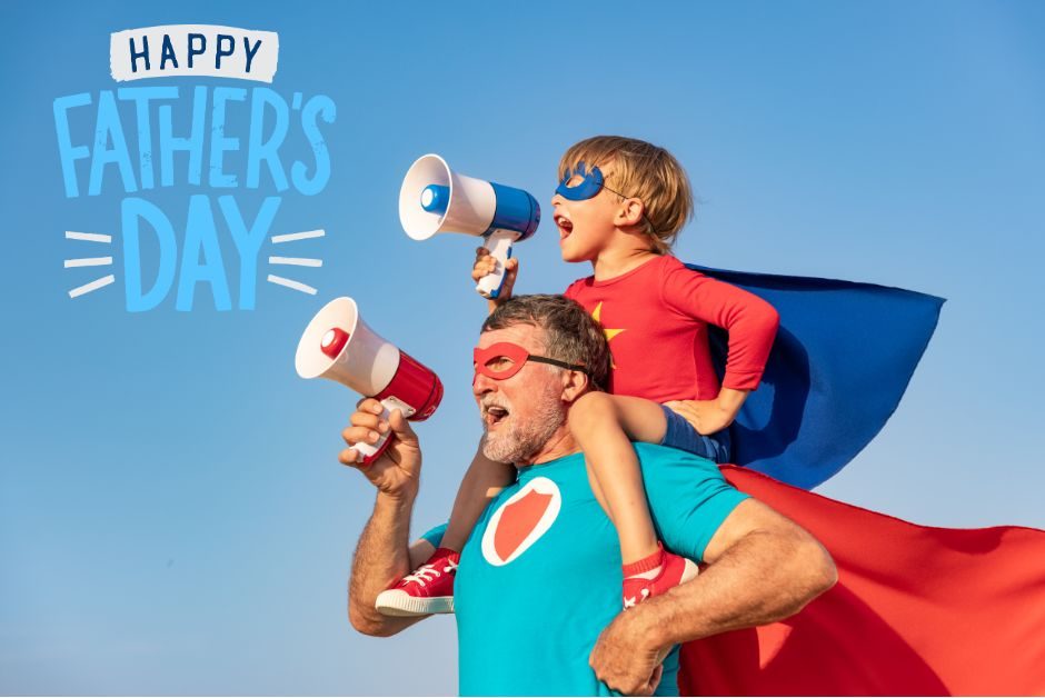 A dad who could be a great book dad with a kid on his shoulders wishing everyone a Happy Father's Day. 